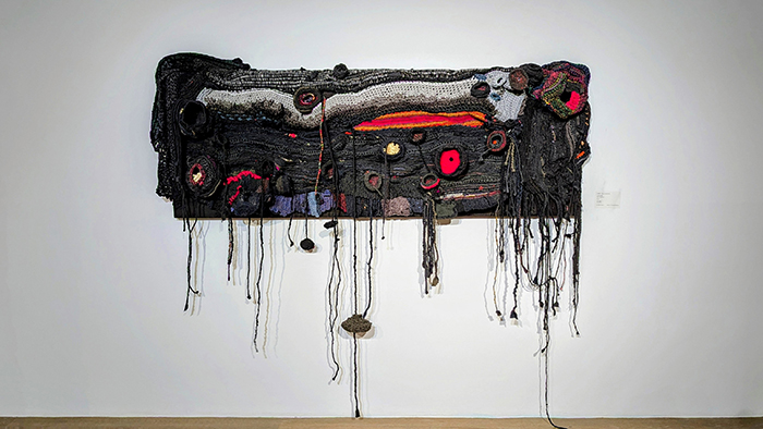 In “Black Stacking I,” Aluaiy explores themes of healing and community through layers of yarn and sculptural form. (Courtesy of Aluaiy Kaumakan)