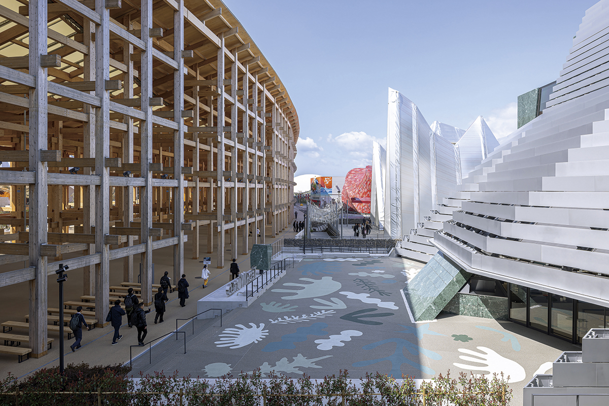 The Tech World Pavilion, right, sits next to the Grand Ring, the signature structure at the 2025 World Expo. (Courtesy of MAYU Architects)