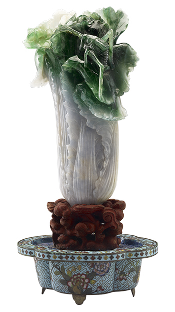 The Jadeite Cabbage is a Qing dynasty carving using the natural shades of the stone to achieve a lifelike rendering of the common vegetable. (Courtesy of NPM)