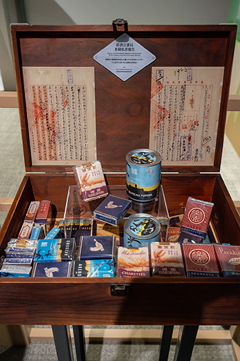 Curators of the exhibit use a recreation of the box of confiscated tobacco that triggered social unrest leading to the February 28 Incident.
