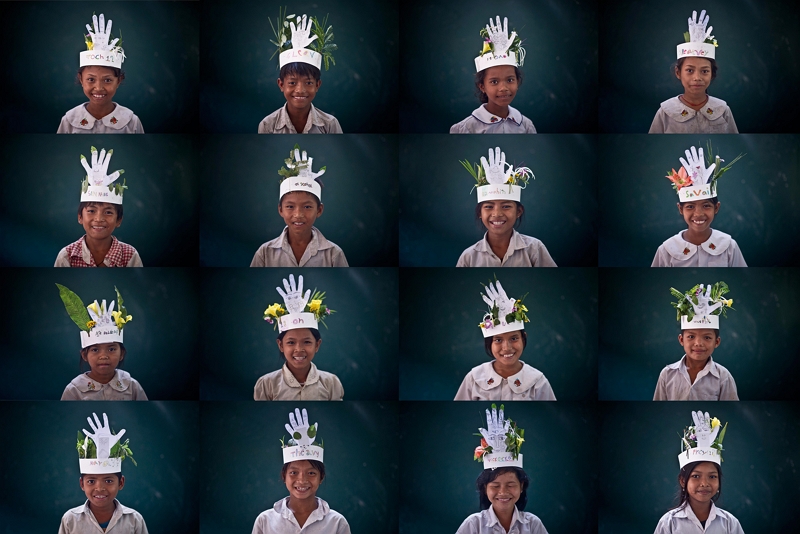 Cambodian children created hats and masks for their art class using plants picked near their homes and cutouts of their hands. (courtesy of Hsu Hung Chieh)