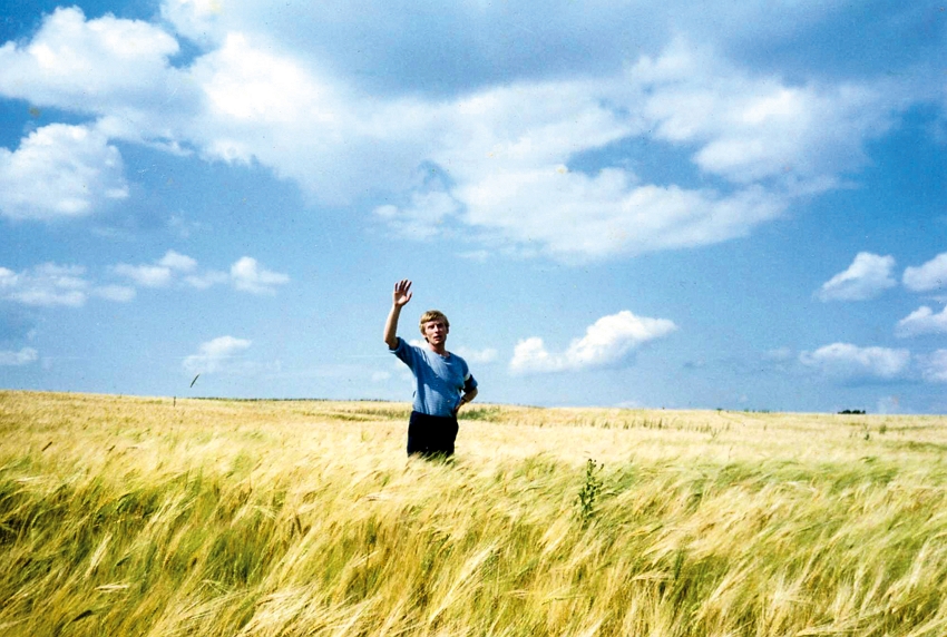 A photo of the young Ivan Yehorov taken by his wife, Marie Lin. The golden yellow of the wheat fields and the blue of the sky are the colors of the Ukrainian flag. (courtesy of Art of Ivan Yehorov)