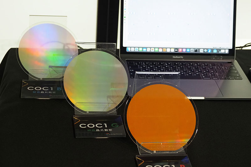 Microscopic LED chips are transferred onto a temporary substrate to create chip-on-carrier (COC) boards.